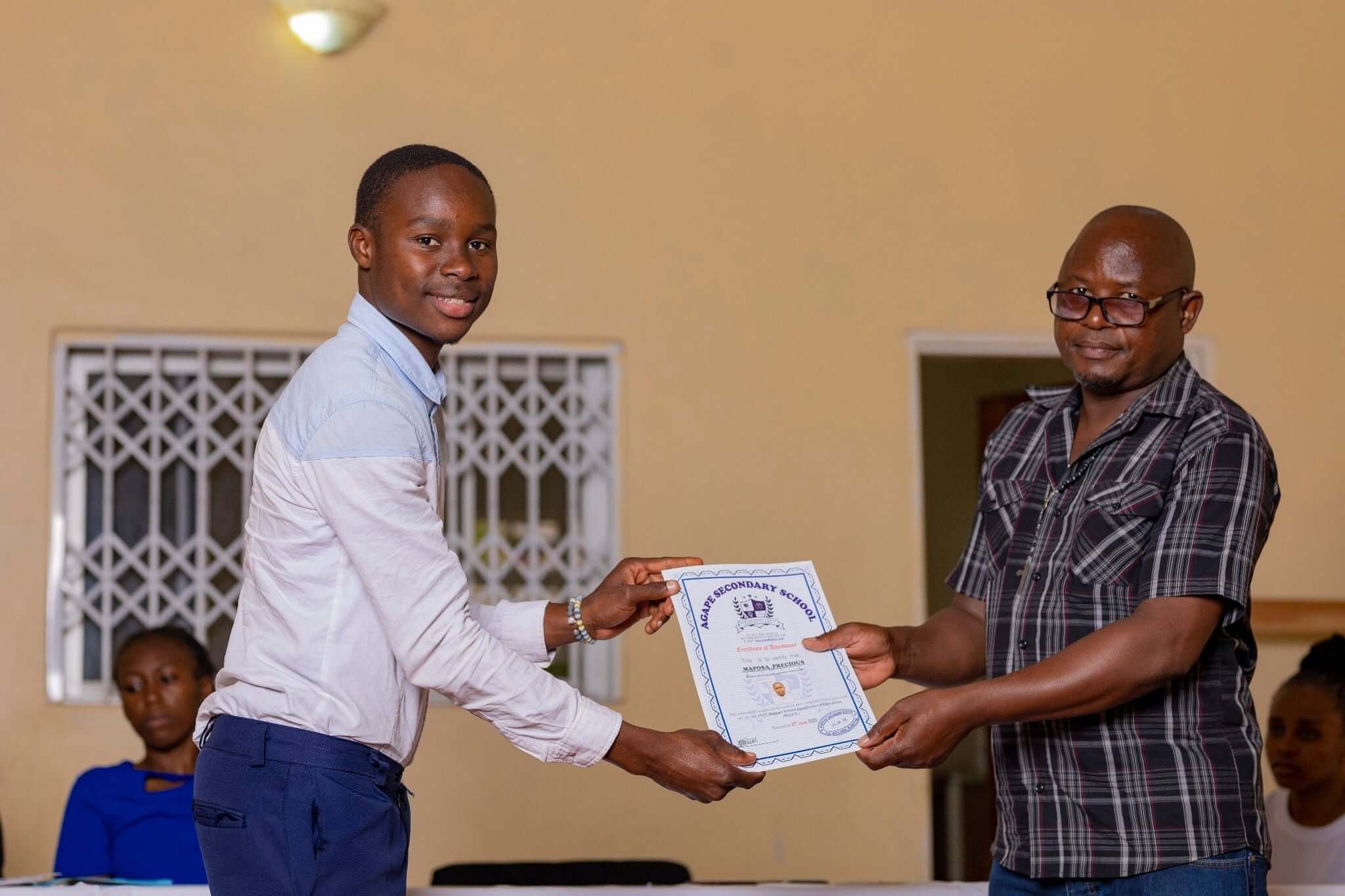 a student recieving a certificate